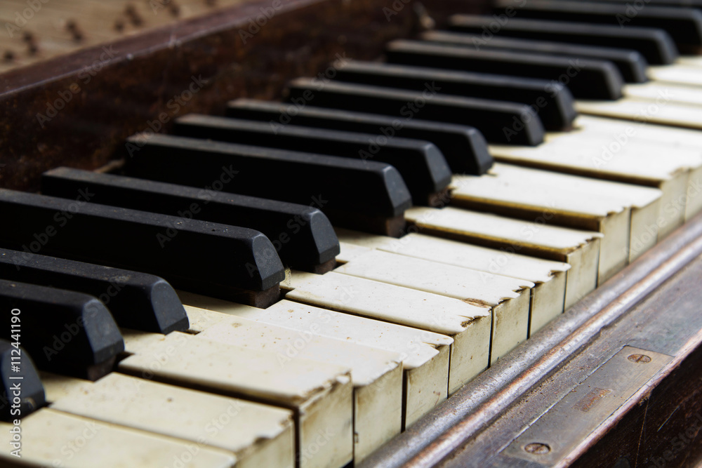 Old broken disused piano with damaged keys Old broken disused piano with damaged keys