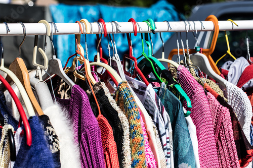 colorful old fashioned women's sweaters at flea market