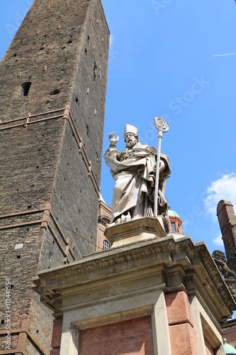 Sculpture San Petronio next to famous tower Garisenda, Bologna Italy  photo