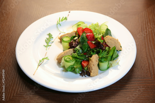 Fresh salad with chicken, tomatoes and mixed greens