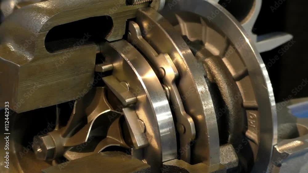 Close view of cutaway car diesel engine turbocharger.Showing moving inside parts, seamless loop Close view of cutaway car diesel engine turbocharger.Showing moving inside parts, seamless loop