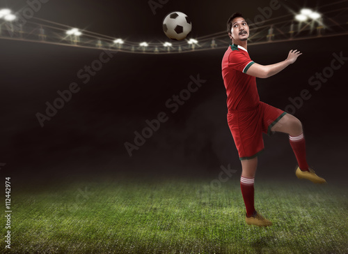 Soccer Player Header Ball © Leo Lintang