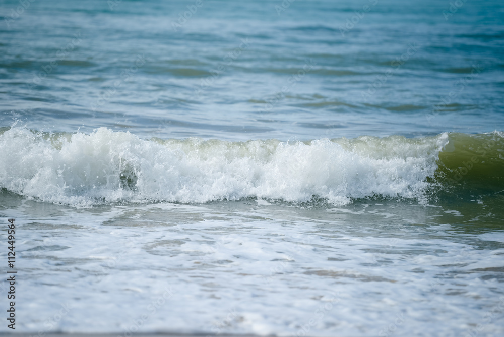 Blue waves of the sea and foam background, reflections of sun light Blue waves of the sea and foam background, reflections of sun light
