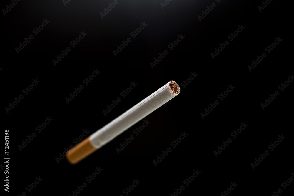 blurred cigarette and black background blurred cigarette and black background