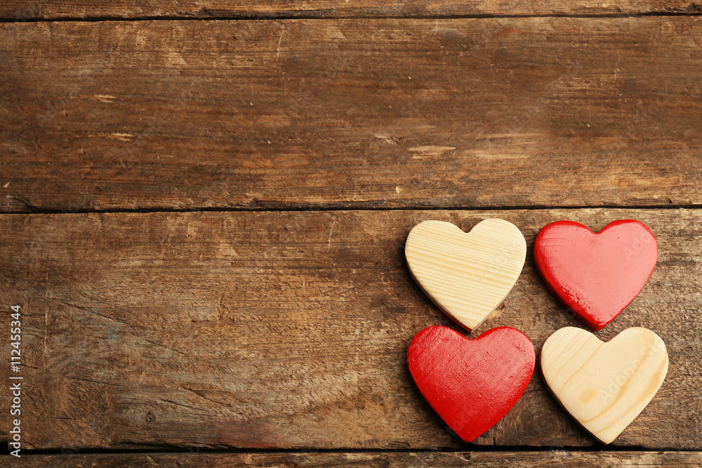 Wooden hearts on rustic wooden background Wooden hearts on rustic wooden background