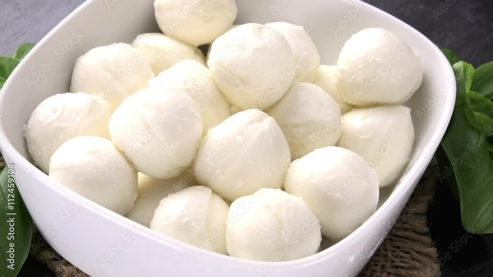 Bowl with small rotating Mozarella balls as not loopable 4K UHD footage Bowl with small rotating Mozarella balls as not loopable 4K UHD footage
