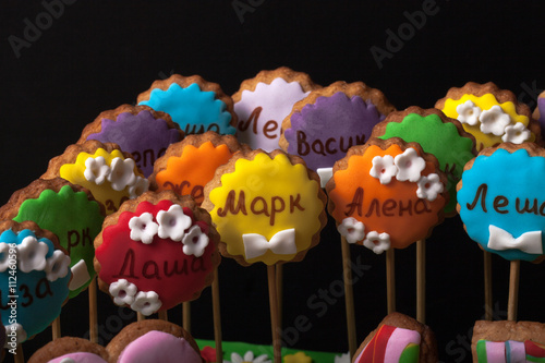 Cake with mastic on prom night on black background. The names of