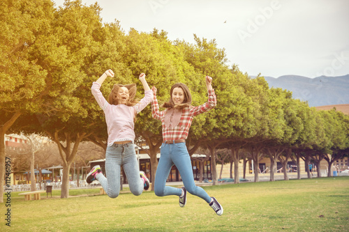 two girls have fun in park