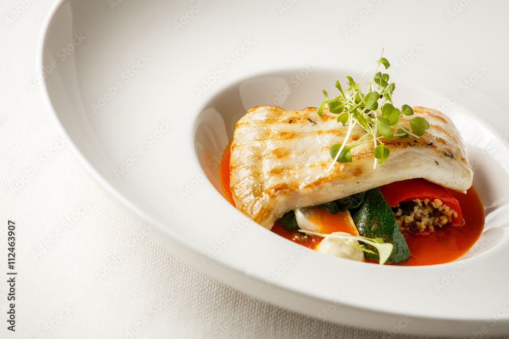Grilled turbot, tabouli, sweet pepper sauce and summer vegetables. White dish