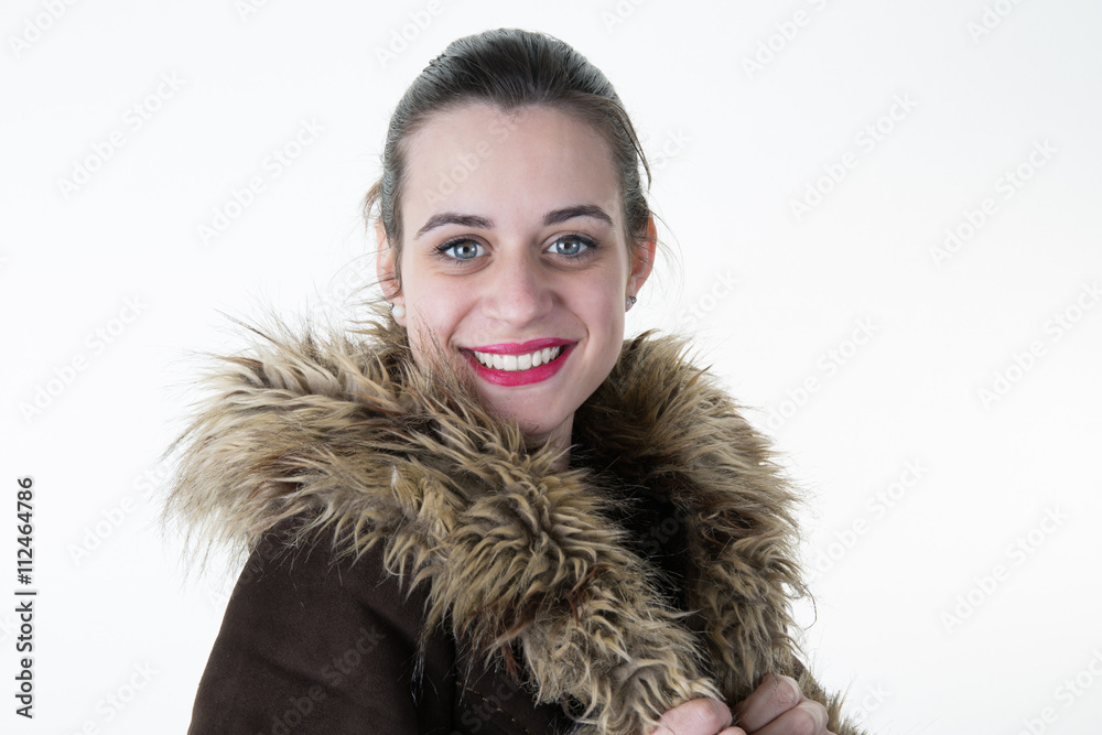 Attractive young woman wearing warm fur coat in winter. Attractive young woman wearing warm fur coat in winter.