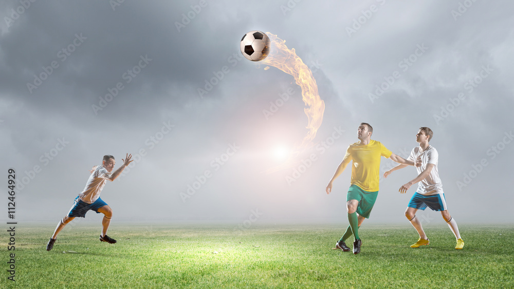 Fototapeta premium Soccer players fighting for ball