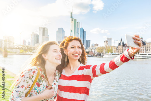 Two beautiful young women taking a selfie on Frankfurt