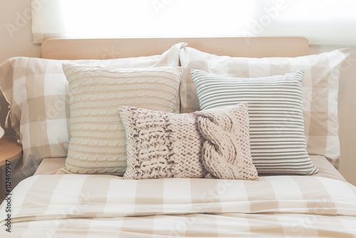 Fototapeta Naklejka Na Ścianę i Meble -  set of pillows on modern bed in modern bedroom