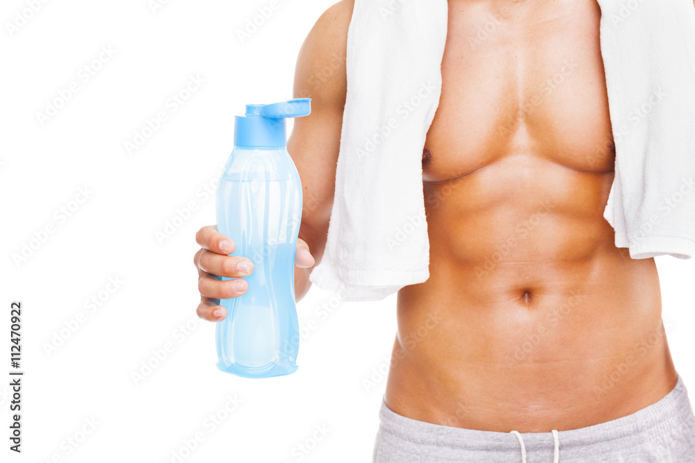 Fit man holding a bottle of water, isolated on white background Fit man holding a bottle of water, isolated on white background