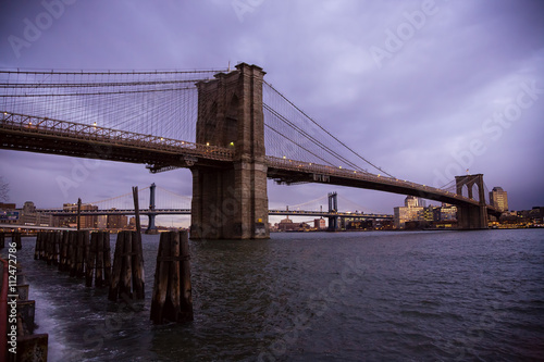 The Brooklyn Bridge in New York City from Seaport at sunrise.