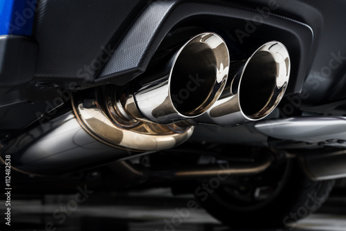Car detailing series : Closeup of clean car muffler photo