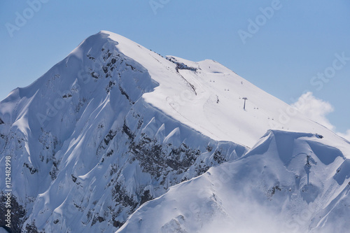 Winter mountain landscape and cloudy sky.