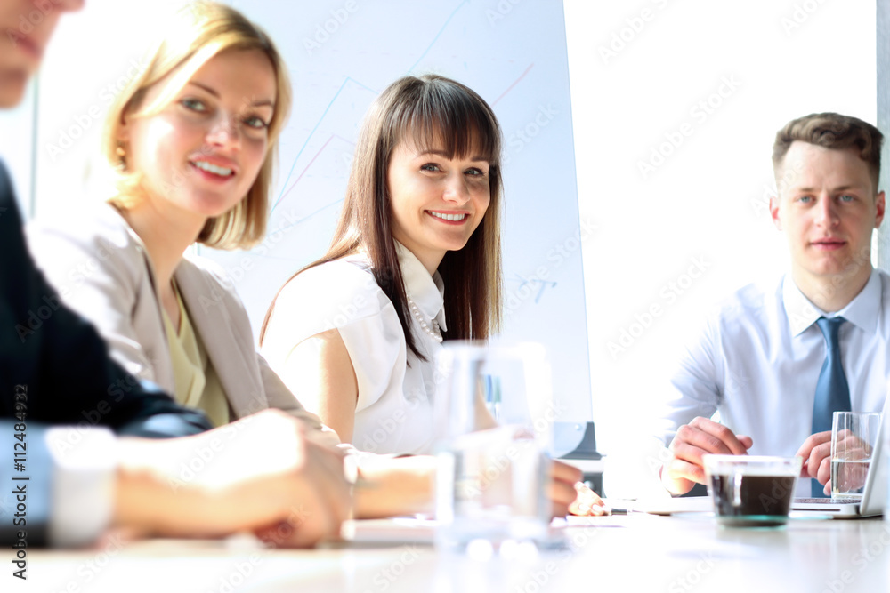 Business colleagues working and analyzing financial figures Business colleagues working and analyzing financial figures