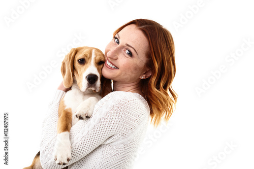 Cheerful young woman with her pretty dog