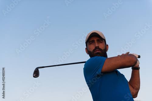 golfer portrait at golf course on sunset