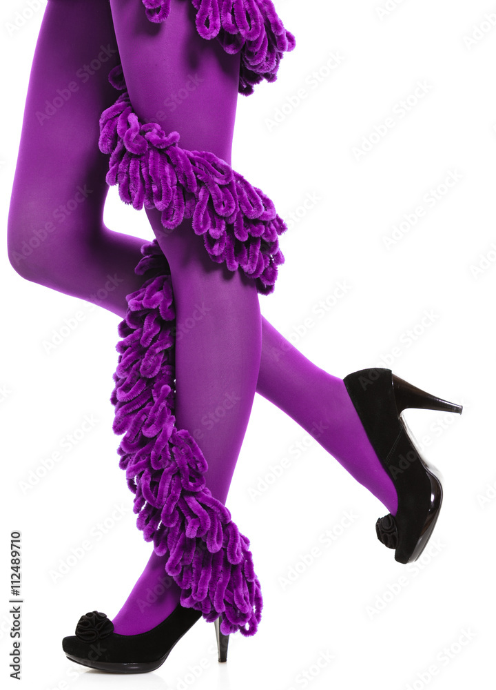 Obraz premium Woman long legs and purple stockings isolated