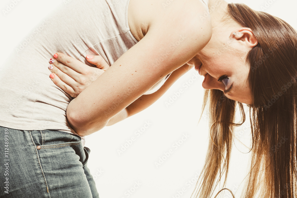 Fototapeta premium Woman suffering from stomachache pain. Period.