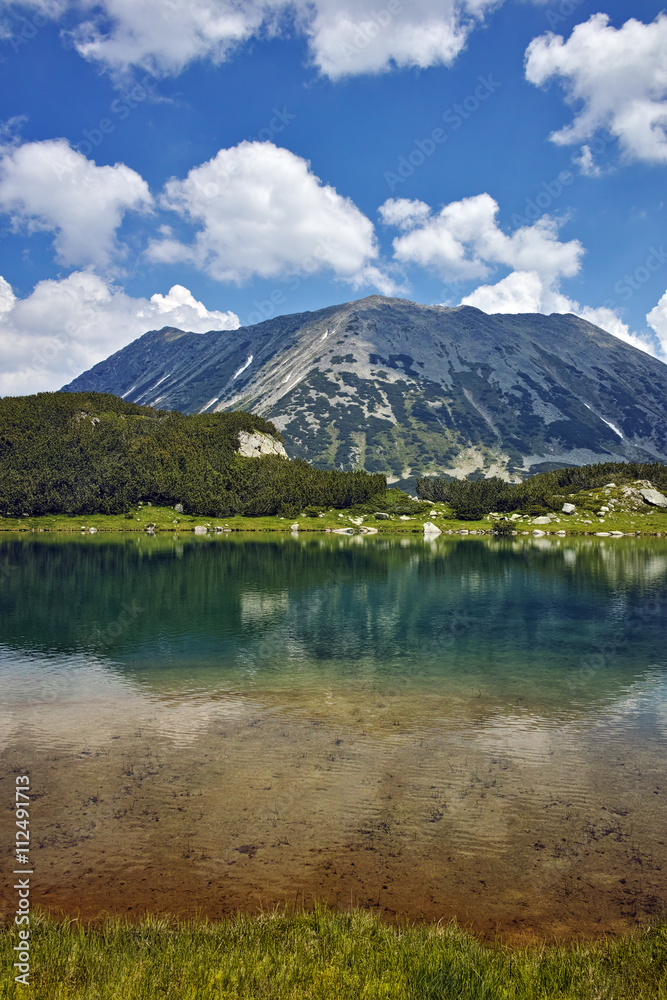 Amazing landscape with Reflection of Todorka peak in Muratovo lake, Pirin Mountain, Bulgaria