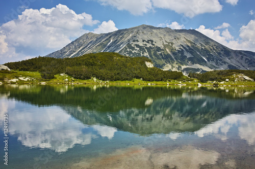 Panoramic view of Todorka peakand Reflection in Muratovo lake  Pirin Mountain  Bulgaria