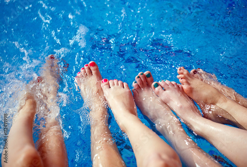 Girls relaxing in swimming pool.