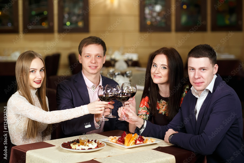 Friends at a restaurant drinking wine. Friends at a restaurant drinking wine.