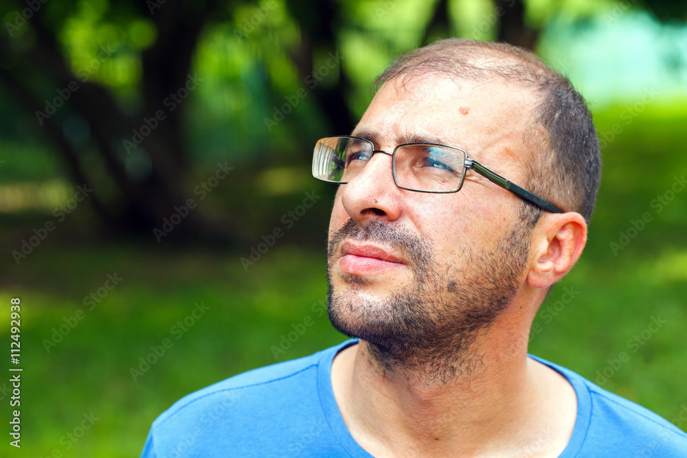 portrait of young man with bad eyesight and hair loss. portrait of young man with bad eyesight and hair loss.
