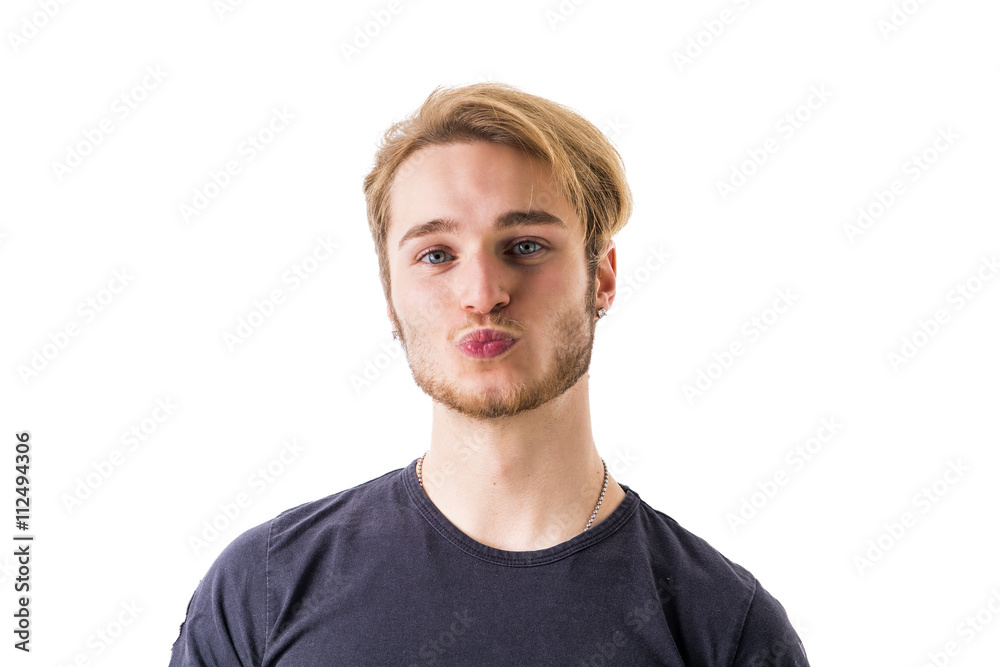 Handsome young man sending a kiss with his lips Handsome young man sending a kiss with his lips