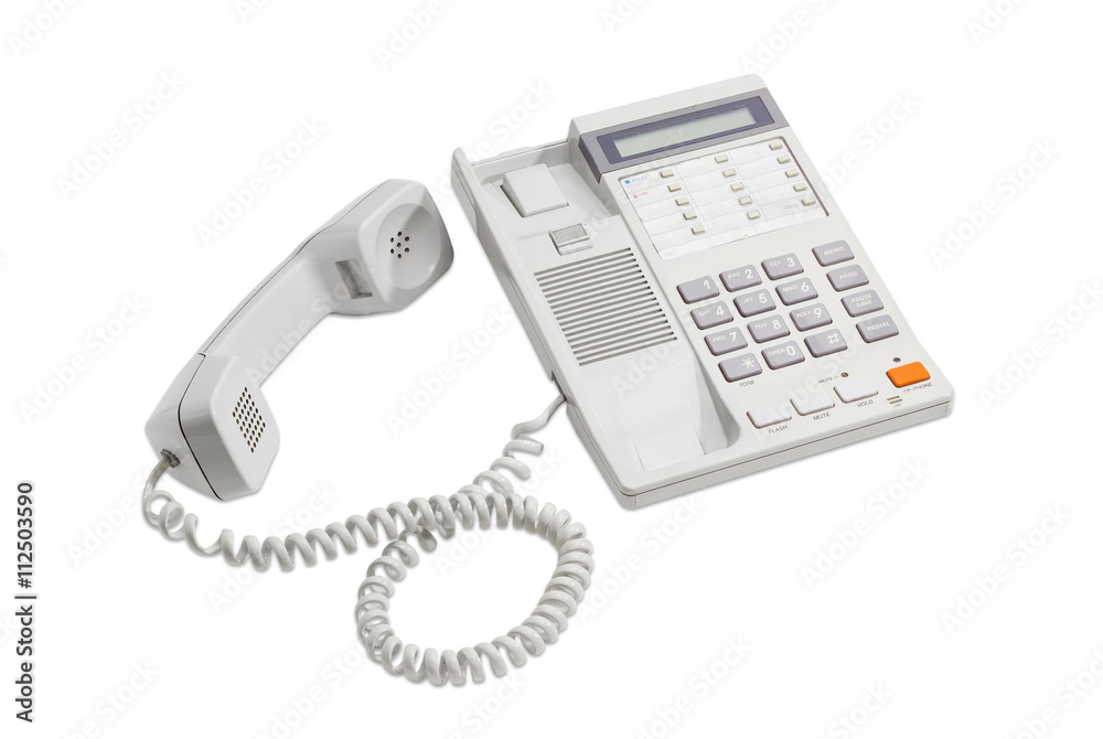 Landline telephone with push button dial on a light background Landline telephone with push button dial on a light background