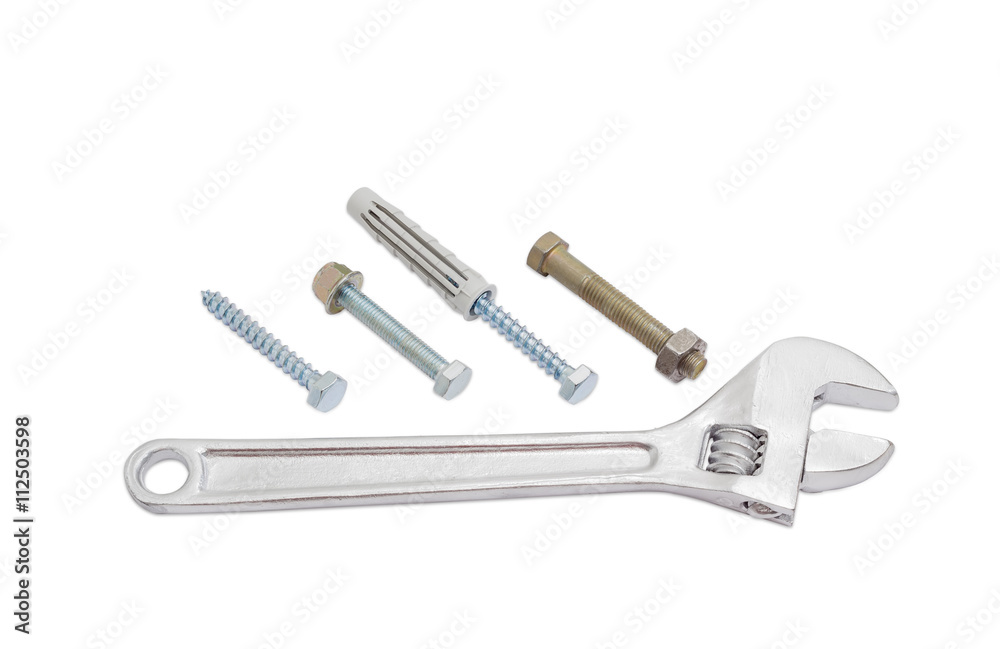 Adjustable wrench and bolts, lag screws and plastic wall plug Adjustable wrench and bolts, lag screws and plastic wall plug