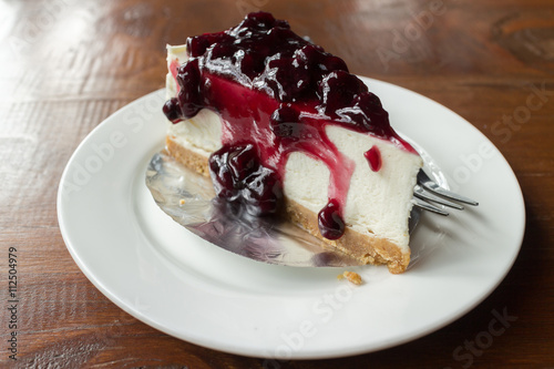 Blueberry cheesecake. Cheesecake with blueberry syrup.