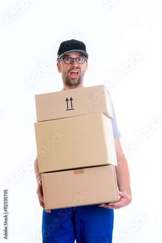 overstrained postman with parcels photo