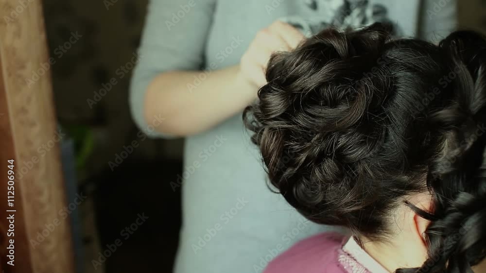 Hairdresser makes hairstyle, close up view with copyspace Hairdresser makes hairstyle, close up view with copyspace