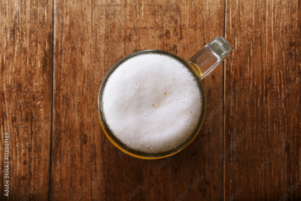 Glass of Beer on the Wooden Table Glass of Beer on the Wooden Table