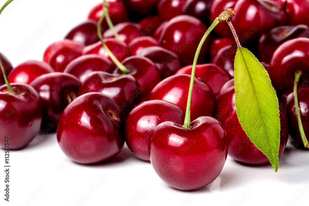 red cherry with leaf isolated on white background red cherry with leaf isolated on white background