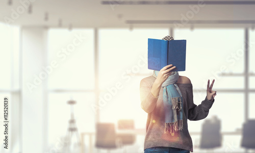 Student girl with book in hands