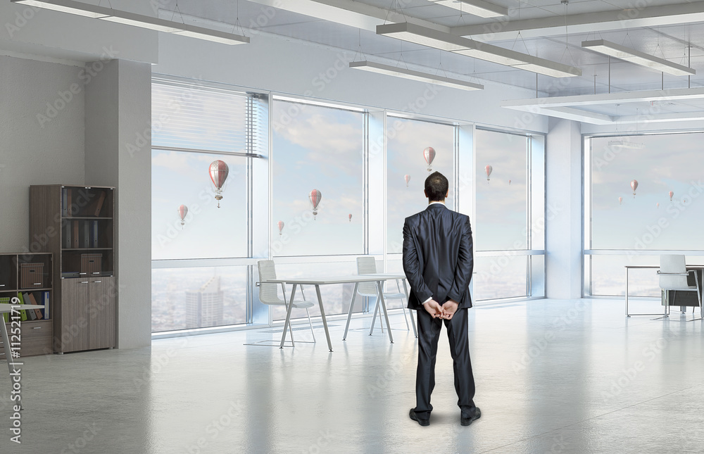 Businessman in office interior Businessman in office interior