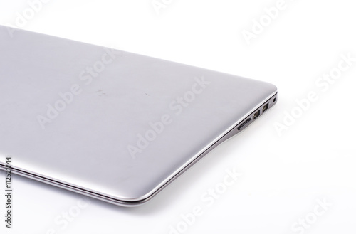 closed silver laptop isolated on pure white with large copy space