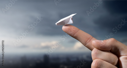 Quadro em tela Paper plane on finger