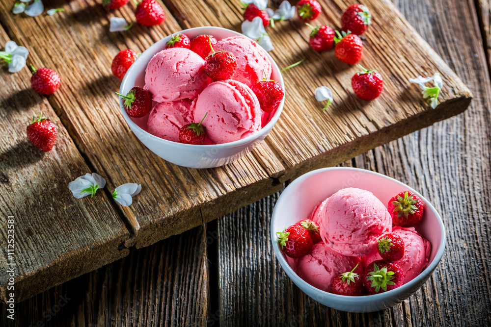 Homemade ice cream with strawberries and mint leaves Homemade ice cream with strawberries and mint leaves