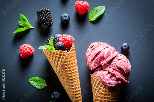 Fresh ice cream with berry fruits in waffels