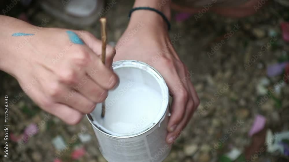 stir the paint in jar
