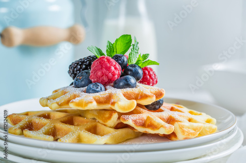 Homemade berries with waffels for breakfast photo