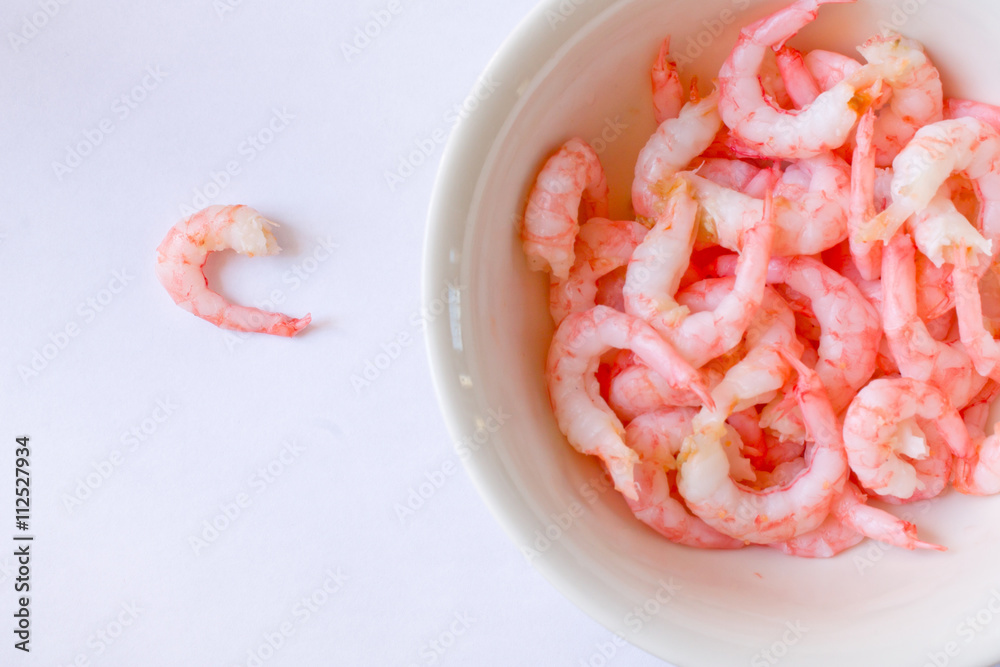 the shrimp in the bowl closeup on white background the shrimp in the bowl closeup on white background