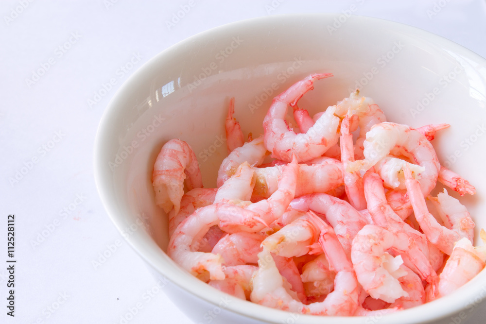 the shrimp in the bowl closeup on white background the shrimp in the bowl closeup on white background