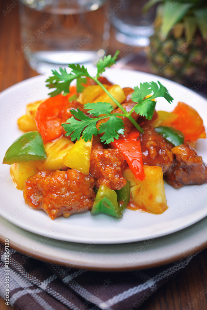 sweet and sour pork. deep fried crispy pork stir fried with pineapple and fresh capsicum, in sour and sweet sauce. worldwide famous sweet and sour pork. chinese cuisine sweet and sour pork. deep fried crispy pork stir fried with pineapple and fresh capsicum, in sour and sweet sauce. worldwide famous sweet and sour pork. chinese cuisine